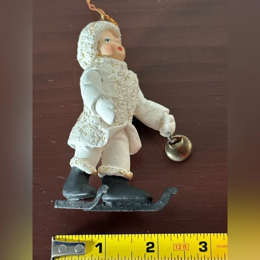 Vintage Department 56 White and Black “Belsnickle” ornament with ringing bell.